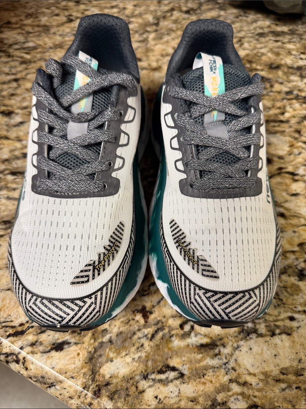 New Balance fresh foam Women’s Running Sneakers in Light Gray with Teal Accents